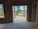 View from inside the garage looking through the unfinished entryway in the concrete block home at 13322 Sw 85 Cir, Ocala, FL 34473