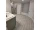 Bathroom featuring tile floors, a glass enclosed shower, a tub, and white painted trim at 13585 Sw 51St Ln, Ocala, FL 34481