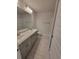 Bright bathroom showcasing a double vanity, granite countertops, and a tub with shower at 13585 Sw 51St Ln, Ocala, FL 34481