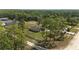 Picturesque aerial shot of a beautiful home surrounded by trees and a fenced yard at 13741 Sw 73Rd St, Ocala, FL 34481