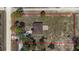 Aerial view of property with a large grassy lot, home, deck and defined by red lines at 13741 Sw 73Rd St, Ocala, FL 34481