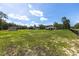 Spacious grassy yard showcases storage building and black ranch fencing at 13741 Sw 73Rd St, Ocala, FL 34481