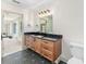 Bathroom featuring tile floors and a wood vanity at 13741 Sw 73Rd St, Ocala, FL 34481