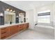 Luxurious bathroom with double vanity, soaker tub, and modern fixtures at 13741 Sw 73Rd St, Ocala, FL 34481