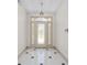 Elegant entryway with decorative glass front door and tile flooring with black accent tiles at 13741 Sw 73Rd St, Ocala, FL 34481