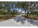 Single-story home with a lengthy driveway, surrounded by a lush landscape, offering a serene setting at 13741 Sw 73Rd St, Ocala, FL 34481