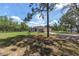 Well-kept front yard with large trees and a charming single-story home at 13741 Sw 73Rd St, Ocala, FL 34481
