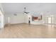 Spacious living room with hardwood floors and an open floor plan to the kitchen at 13741 Sw 73Rd St, Ocala, FL 34481