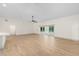 Spacious living room with hardwood floors, open layout, and view of the patio at 13741 Sw 73Rd St, Ocala, FL 34481