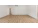 Bright living room with hardwood floors, neutral paint, and an open doorway at 13741 Sw 73Rd St, Ocala, FL 34481