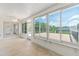 Enclosed patio with sliding windows and doors overlooking the backyard deck and trees at 13741 Sw 73Rd St, Ocala, FL 34481