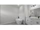 Bright primary bathroom featuring a modern soaking tub, double vanity with sleek black fixtures, and recessed lighting at 13780 Sw 42Nd Court Rd, Ocala, FL 34473