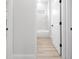 Hallway view of a stylish bathroom with modern features at 13780 Sw 42Nd Court Rd, Ocala, FL 34473