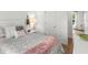 Bedroom features comfortable queen bed with pillows and blanket and bright natural light at 15138 Sw 50Th Avenue Rd, Ocala, FL 34473