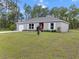 Lovely single-story home with manicured front lawn and charming curb appeal at 15138 Sw 50Th Avenue Rd, Ocala, FL 34473