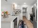 Bright kitchen featuring stainless steel appliances, granite countertops, and a stylish wine rack at 15138 Sw 50Th Avenue Rd, Ocala, FL 34473