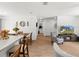 Open-concept living room with adjacent kitchen and dining areas at 15138 Sw 50Th Avenue Rd, Ocala, FL 34473