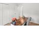 Office features a wooden desk, chair, a vase of flowers, and white walls at 15138 Sw 50Th Avenue Rd, Ocala, FL 34473