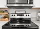 Stainless steel electric range with microwave and designer details at 15138 Sw 50Th Avenue Rd, Ocala, FL 34473