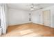 Well lit bedroom features hard wood floors and a ceiling fan at 1630 Se 29Th Ter, Ocala, FL 34471