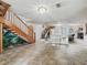 Spacious entryway with stairs, tile flooring, and a decorative mural accent at 1630 Se 29Th Ter, Ocala, FL 34471