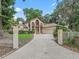 Elegant home exterior featuring manicured lawn and stately entrance columns at 1630 Se 29Th Ter, Ocala, FL 34471