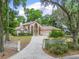 Elegant two-story home featuring dual balconies, a patterned concrete driveway, and lush landscaping in a desirable neighborhood at 1630 Se 29Th Ter, Ocala, FL 34471