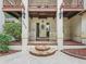 Charming home entrance with stone steps, decorative door, and manicured landscaping at 1630 Se 29Th Ter, Ocala, FL 34471