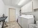 Well-organized laundry room with washer, dryer, and ample storage space at 1630 Se 29Th Ter, Ocala, FL 34471