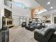 Expansive living room with soaring ceilings and views of the second-story balcony at 1630 Se 29Th Ter, Ocala, FL 34471