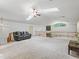 Bright open-concept living area with skylights, vaulted ceiling, and a railing overlooking the floor below at 1630 Se 29Th Ter, Ocala, FL 34471