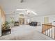 Bright and airy living room with a skylights, French doors, and second-story access at 1630 Se 29Th Ter, Ocala, FL 34471