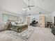 Inviting bedroom with a comfortable bed, skylight, and ample space for a home office setup at 1630 Se 29Th Ter, Ocala, FL 34471