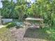 A spacious backyard featuring a wooden structure, offering a glimpse into a private outdoor retreat with potential at 1636 Sw 5Th Pl, Ocala, FL 34471