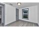 Freshly painted bedroom featuring hardwood floors, baseboard trim, and natural light at 1636 Sw 5Th Pl, Ocala, FL 34471