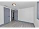 Bedroom featuring wood-look flooring, painted trim, updated windows, and a fresh paint job at 1636 Sw 5Th Pl, Ocala, FL 34471