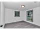 Bedroom with new flooring, updated windows, and natural light, freshly painted at 1636 Sw 5Th Pl, Ocala, FL 34471