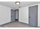 Bedroom showcasing fresh paint, baseboard trim, new light fixture, and open doorway at 1636 Sw 5Th Pl, Ocala, FL 34471