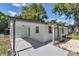 Charming single-story home featuring a covered parking area, complemented by a bright blue door at 1636 Sw 5Th Pl, Ocala, FL 34471