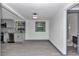 Kitchen with grey shaker cabinets, stainless steel appliances, and access to bathroom at 1636 Sw 5Th Pl, Ocala, FL 34471
