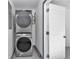 Modern laundry area with stacked washer and dryer units, offering convenience and efficiency at 1636 Sw 5Th Pl, Ocala, FL 34471