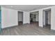 Bright living room with grey trim, open floor plan, and wood-look flooring throughout at 1636 Sw 5Th Pl, Ocala, FL 34471