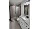 Modern bathroom showcasing granite vanity and updated glass shower at 1780 Winding Hills Rd, Dunnellon, FL 34431