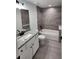 Modern bathroom featuring tile shower, granite countertops and sleek fixtures at 1780 Winding Hills Rd, Dunnellon, FL 34431