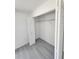 Open closet in a bedroom with a wire shelf and a door to open for access at 1780 Winding Hills Rd, Dunnellon, FL 34431