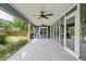 Wide view of the back porch and backyard, showcasing the open patio and screened-in section at 1841 Ne 38Th St, Ocala, FL 34479