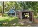 View of the backyard with a covered gazebo, grill and outdoor seating area at 1841 Ne 38Th St, Ocala, FL 34479