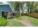 Manicured backyard with a covered structure and a grill, providing a private outdoor retreat at 1841 Ne 38Th St, Ocala, FL 34479