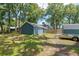 View of the backyard with a shed and trailer at 1841 Ne 38Th St, Ocala, FL 34479