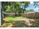 View of the spacious backyard with a wood privacy fence at 1841 Ne 38Th St, Ocala, FL 34479